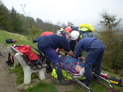 Another patient is strapped into the stretcher